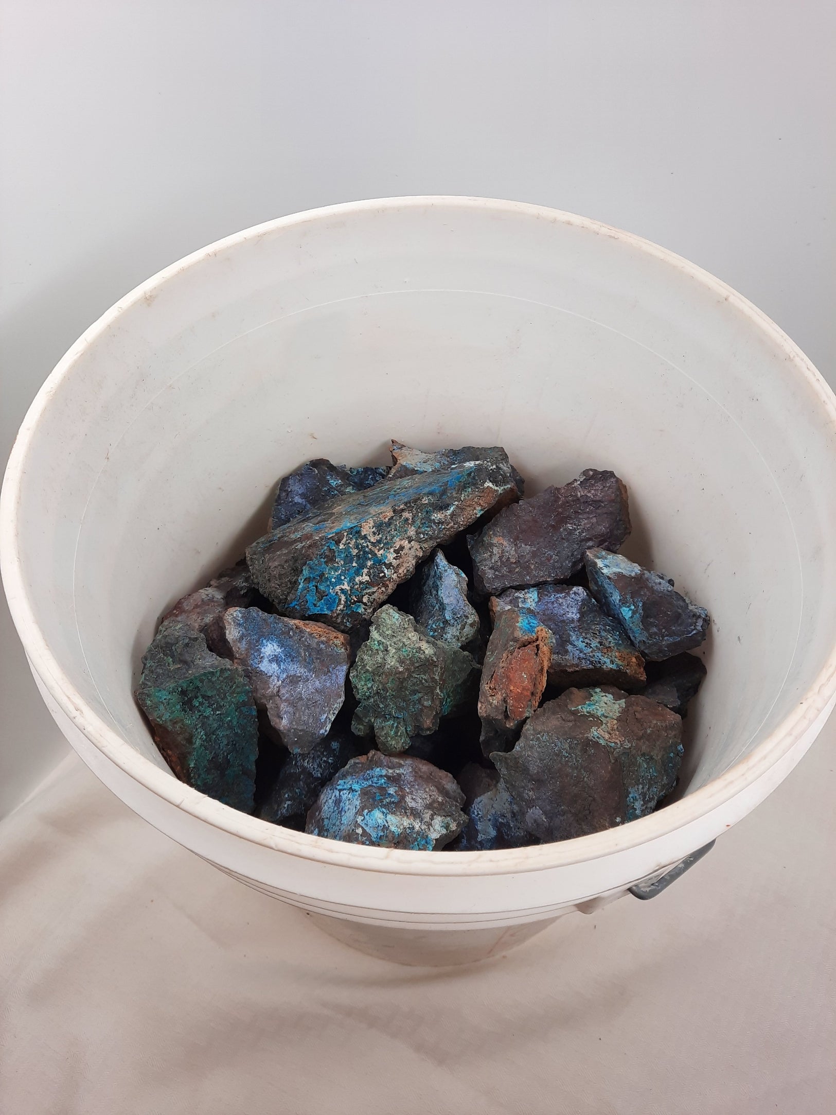 Wholesale Specular Hematite - dark stones with crisp blues and tans